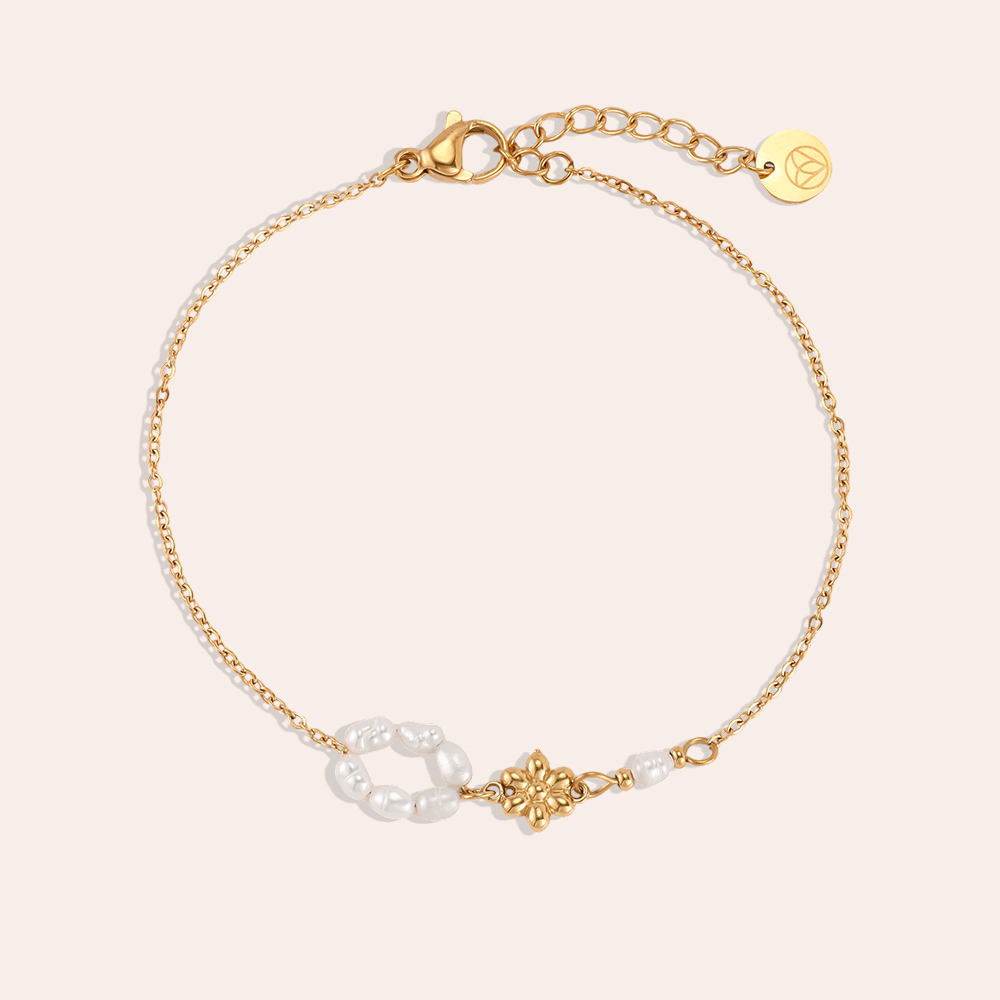 Stainless steel bracelet, 17cm, with a beaded ring and a golden flower