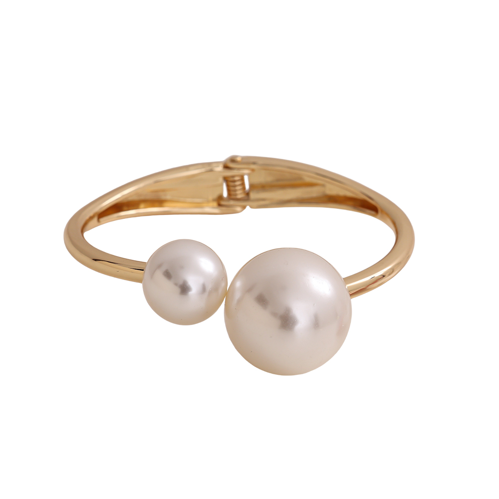 6.5cm wide round bangle with two brass beads   