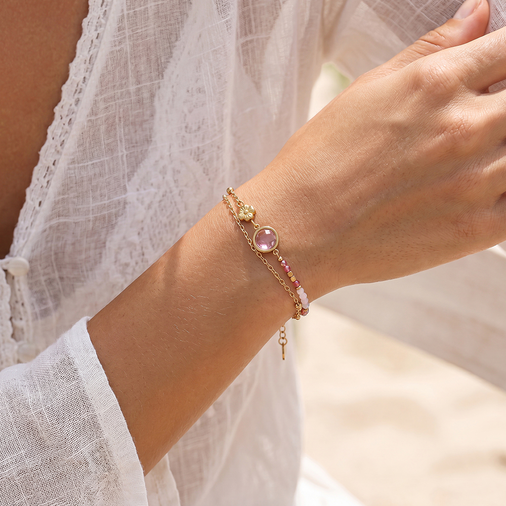Stainless steel bracelet, 17 cm, with a round pink cubic zirconia and a small gold flower