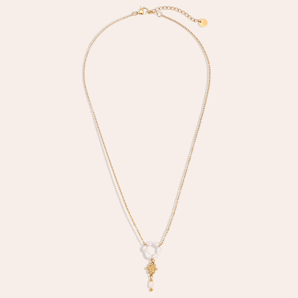 Stainless steel necklace, 42cm, with a beaded ring and a gold flower
