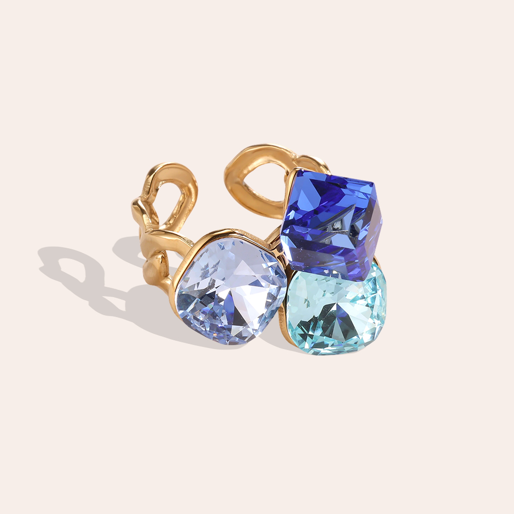 Stainless steel ring, adjustable, with three large glass stones in different colours