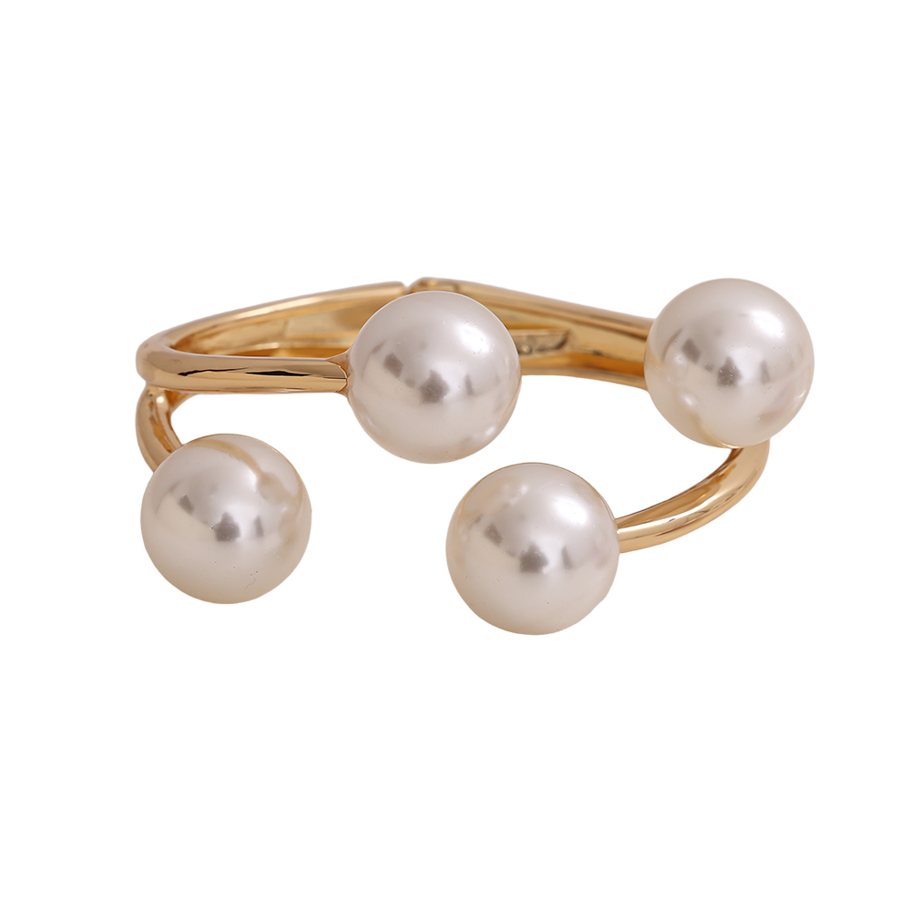 6.5cm wide round bangle with four brass beads    