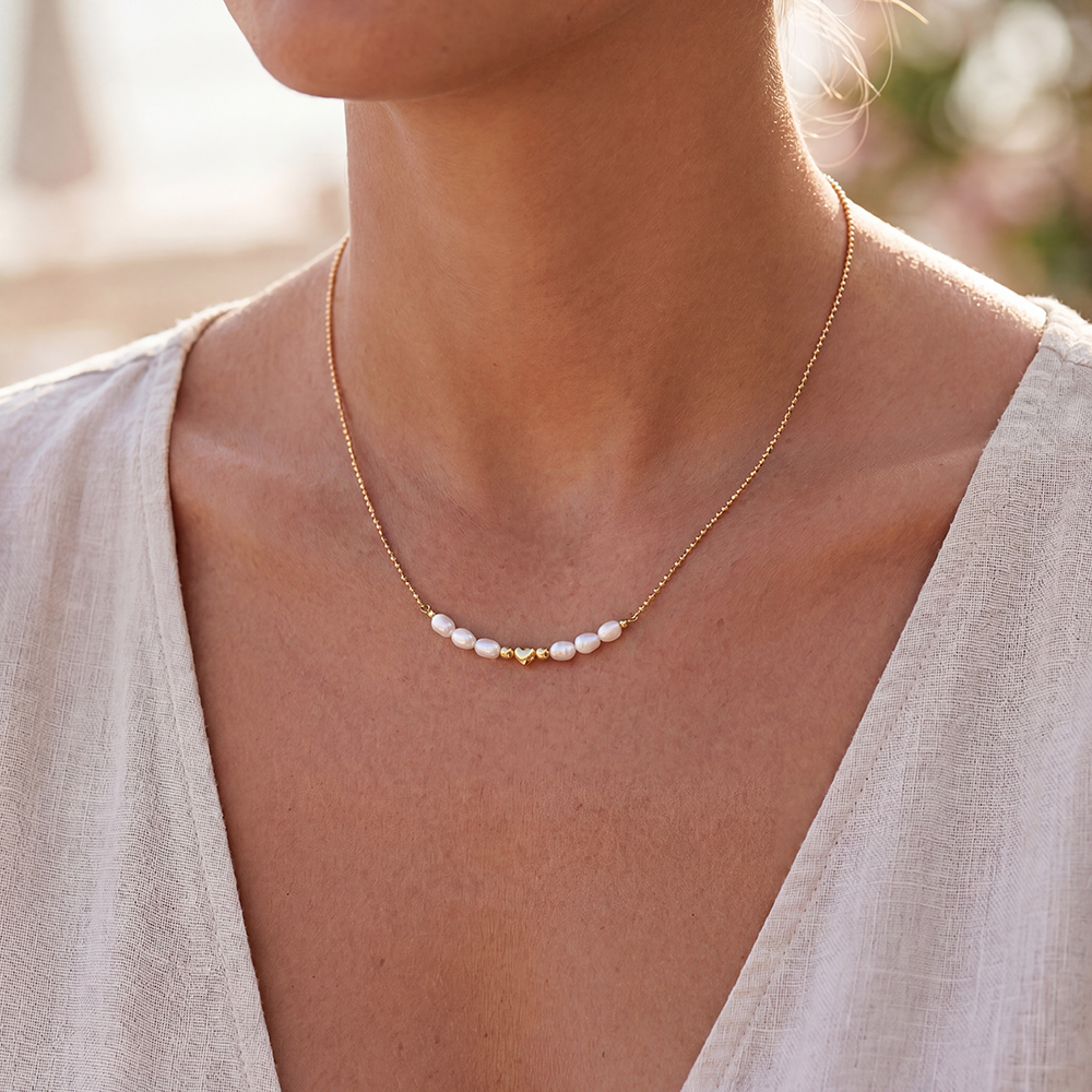 Stainless steel necklace, 42cm, with a pearl and a mini heart 