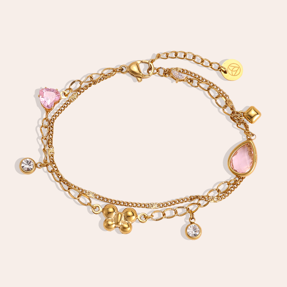 Stainless steel bracelet, 17 cm, with pink glass and a gold butterfly