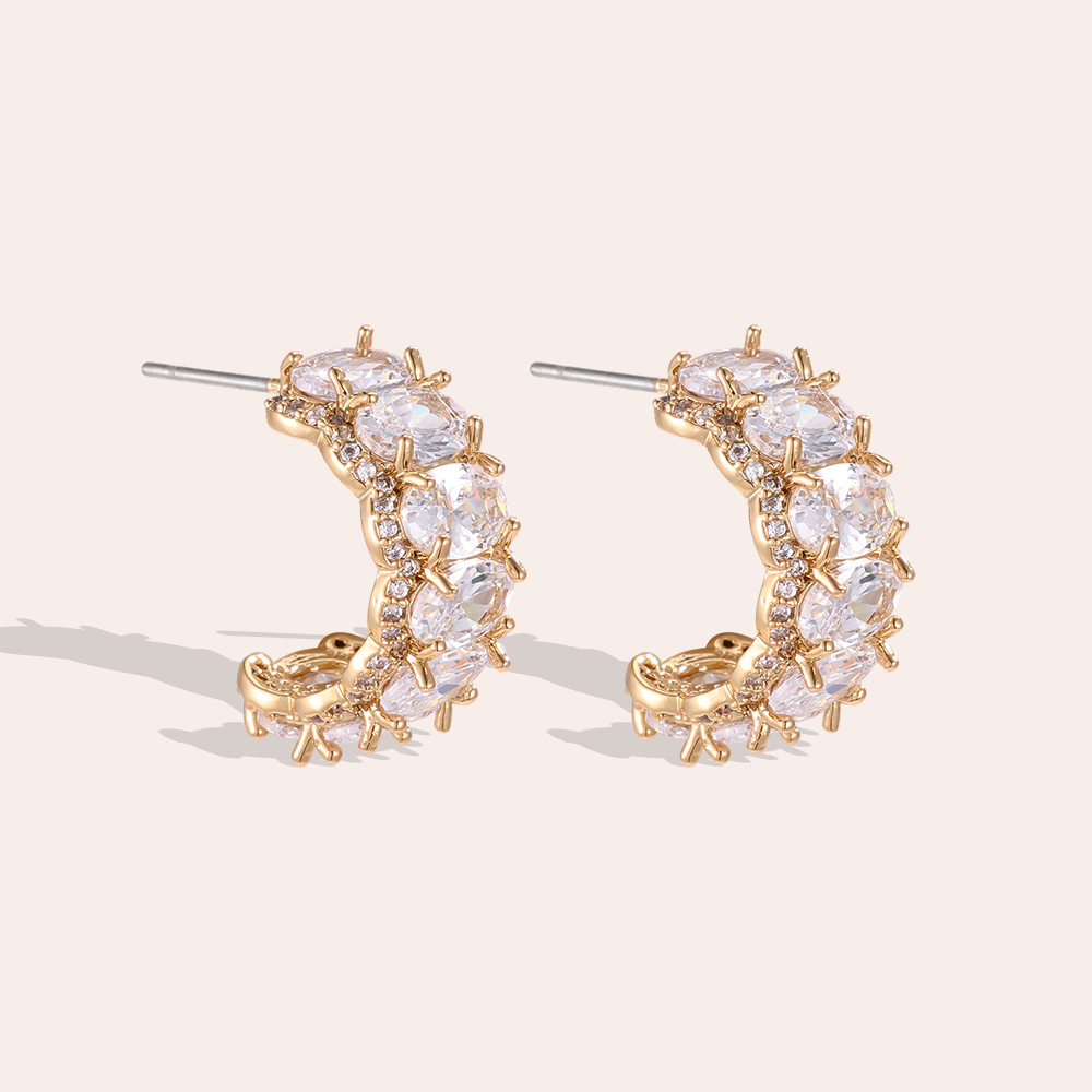 Gold-plated 19mm half-hoop earrings with lots of oval-cut cubic zirconia