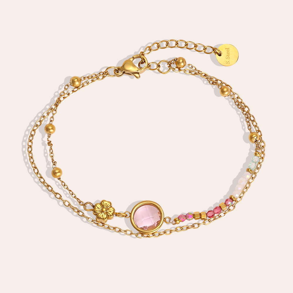Stainless steel bracelet, 17 cm, with a round pink cubic zirconia and a small gold flower